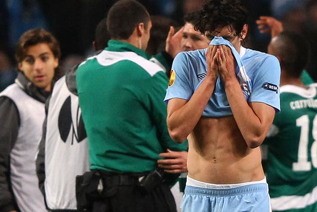 Stefan Savic walks dejected at the final whistle