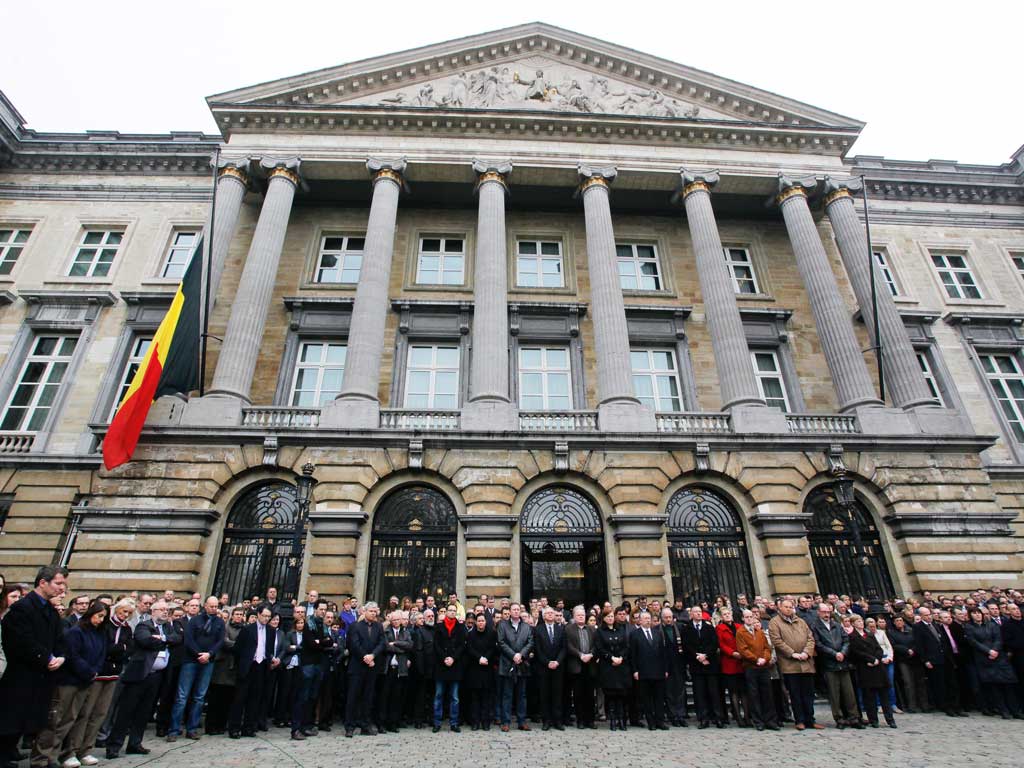 Belgian parliament and senate members observe a minute's silence today
