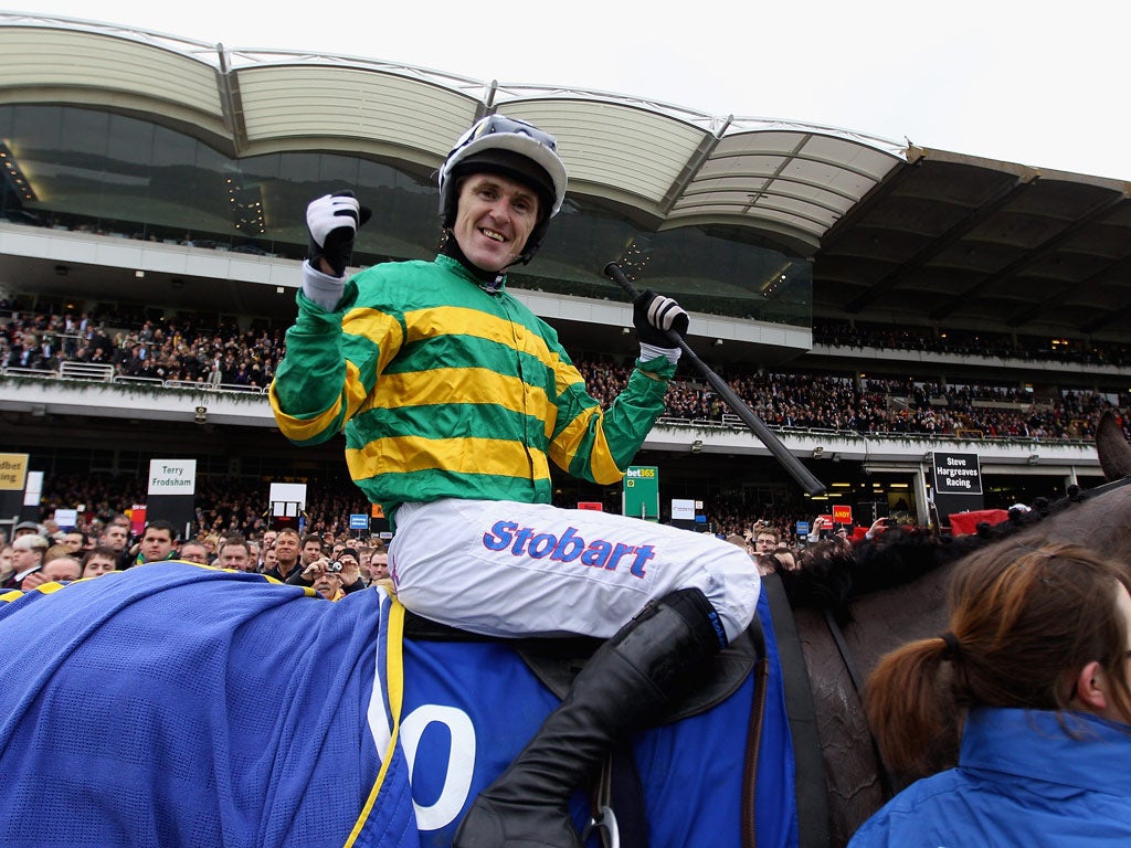 Tony McCoy celebrates ridding Synchronised to victory in the Betfred Cheltenham Gold Cup Steeple Chase