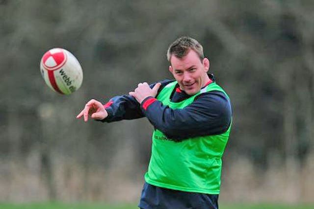 Matthew Rees flings a pass during training yesterday