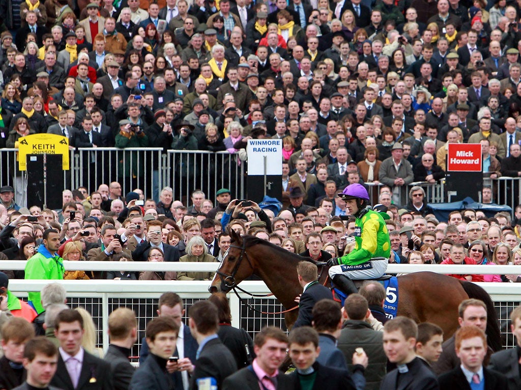 Ruby Walsh rides Kauto Star back after the Cheltenham Gold Cup