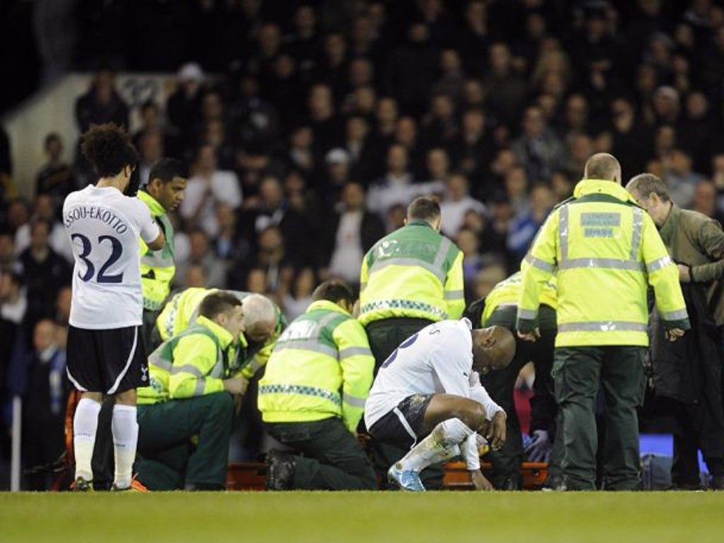 Bolton's Fabrice Muamba receives medical attention during the English FA Cup quarter final match between Totthenham Hotspurs and Bolton Wanderers