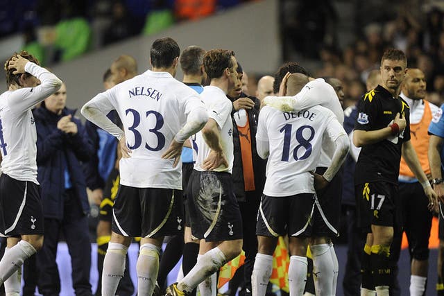 Tottenham Hotspur's Jermain Defoe, Ryan Nelsen and Luka Modric react after Bolton Wanderers' Fabrice Muamba is carried off on a stretcher