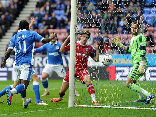 Opening salvo: James McArthur (obscured by Victor Moses) becomes only the second Wigan player to score at the DW Stadium in 2012