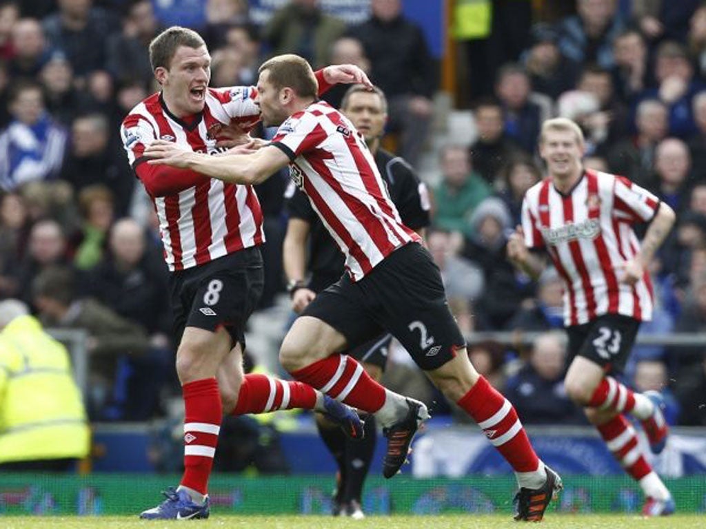 Super strike: Phil Bardsley (centre) races away to celebrate after giving Sunderland the lead with a piledriver