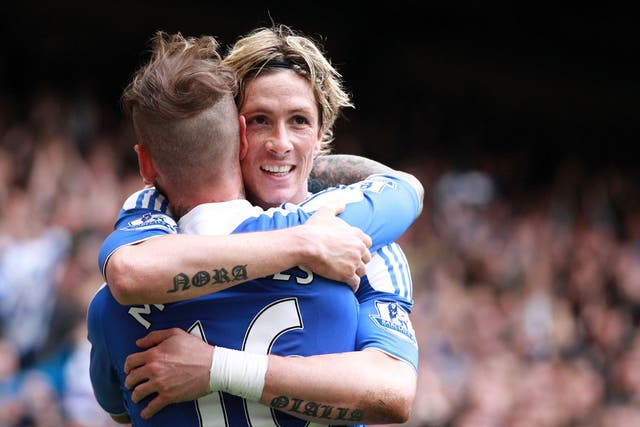 Torres is congratulated by Raul Meireles after his second goal at Stamford Bridge today