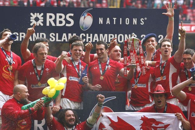 Captain Sam Warburton holds the Six Nations trophy during Wales’ Grand Slam celebrations