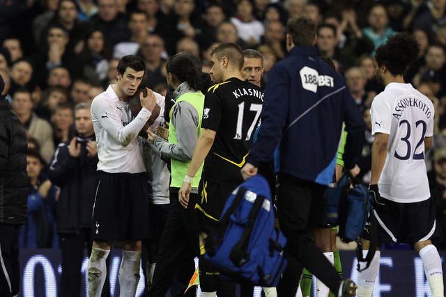 <b>17 March 2012</b><br/>
Gareth Bale consoles teammate Jermain Defoe after Fabrice Muamba collapses during Tottenham and Bolton’s FA Cup clash. The Bolton player received CPR on the pitch before being rushed to hospital. 
