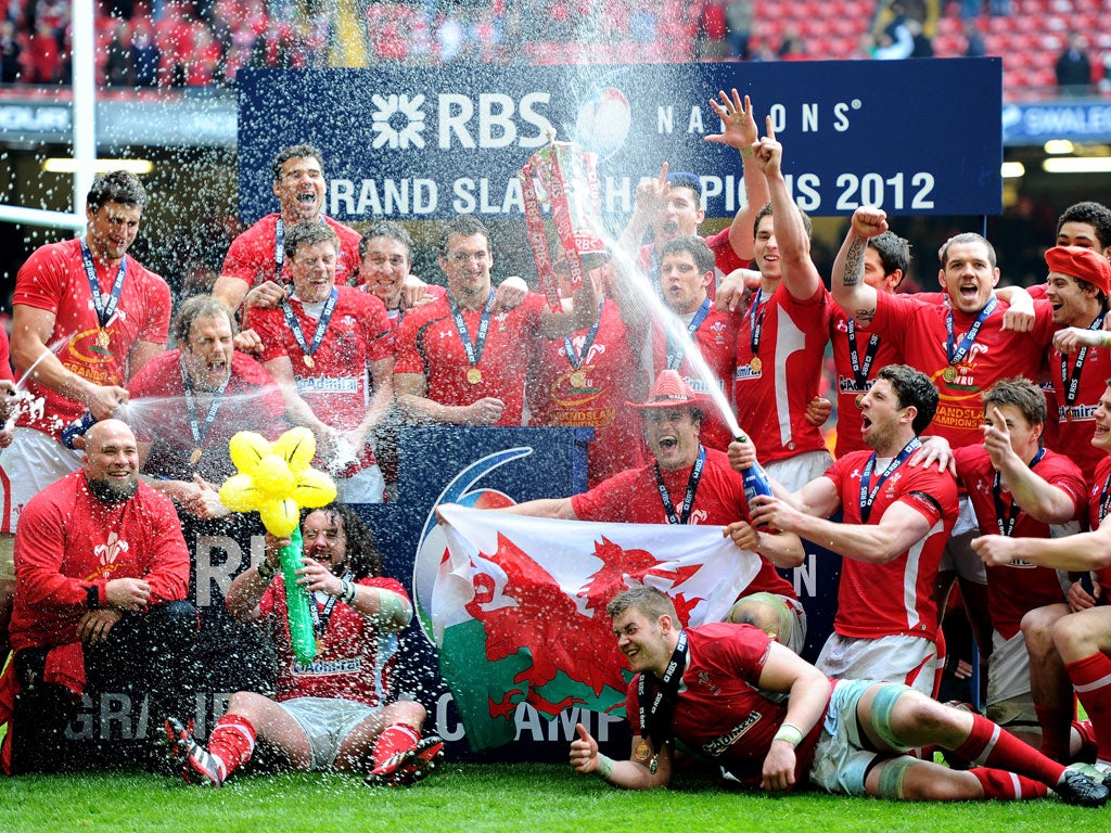 17 March 2012 Wales players celebrate after defeating France 16-9 and clinching their third Grand Slam in eight years. The win avenged their World Cup semi-final defeat to the French five months ago and made Gatland the first southern hemisph