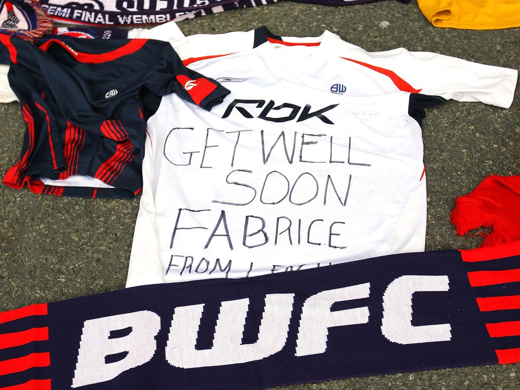 19 March 2012 Tributes and get well messages are laid outside the Reebok Stadium for Bolton Wanderers' Fabrice Muamba