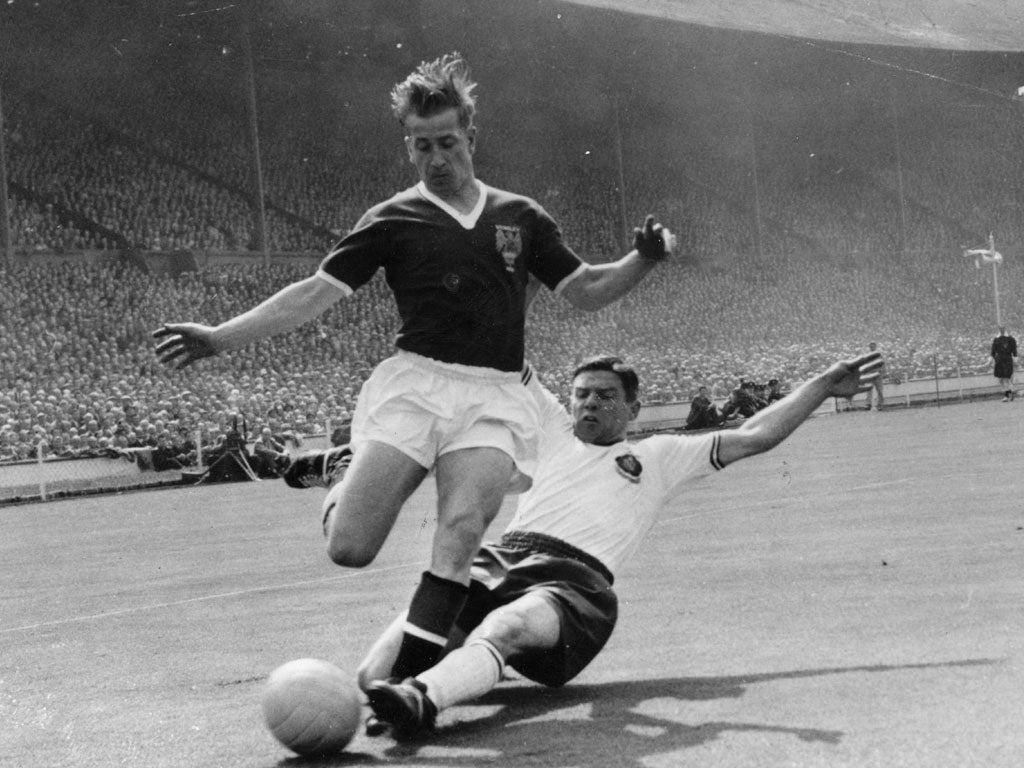 Bobby Charlton in FA Cup final action for Manchester United at Wembley in 1958, just months after the Munich air crash