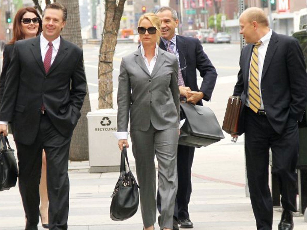 Actress Nicollette Sheridan arrives at the court with her legal team