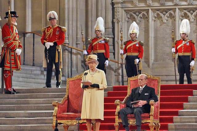 Prince Philip looks on as the Queen addresses both Houses of Parliament yesterday