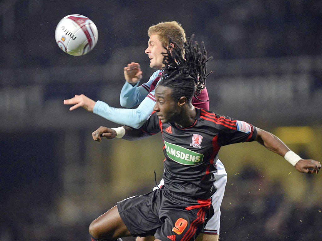 West Ham United's Danny Collins outjumps Marvin Emnes last night