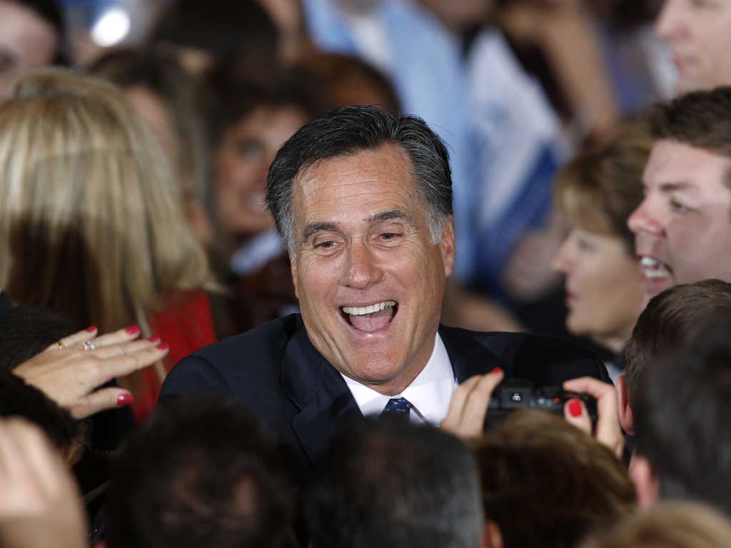 Mitt Romney greets supporters during his Illinois rally