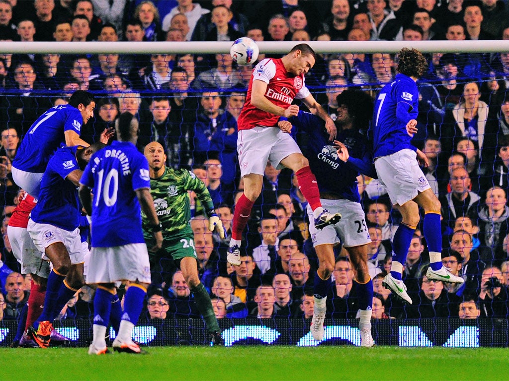 Thomas Vermaelen rises above the Everton defence to head Arsenal into the lead
