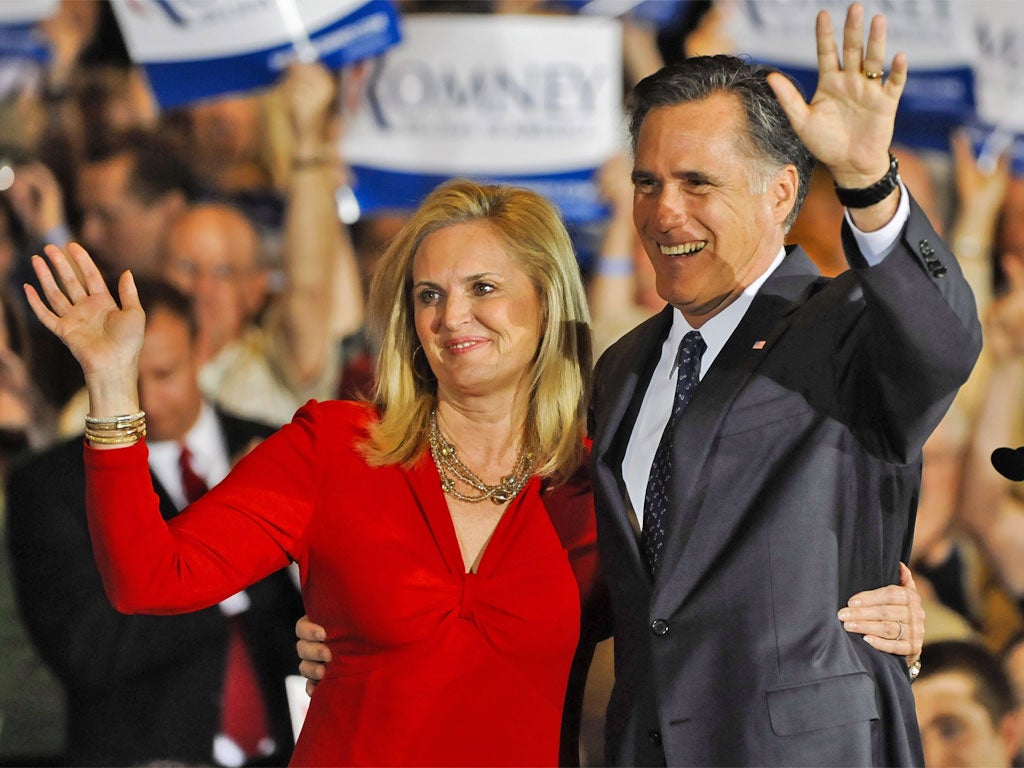 Republican front runner Mitt Romney and his wife, Ann, celebrate his win in the Illinois primary