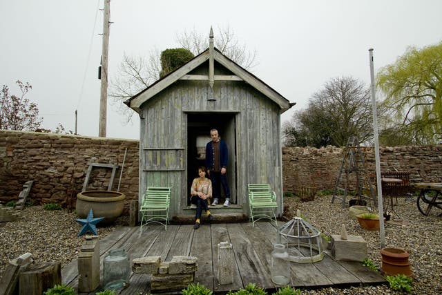 Sally and Mark Bailey outside one of the converted barns where they sell their unique, custom-made garden tools and household goods