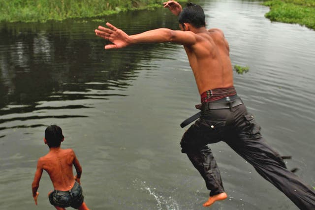 Bangladeshi children often play in and around water without supervision. Many have never learned to swim