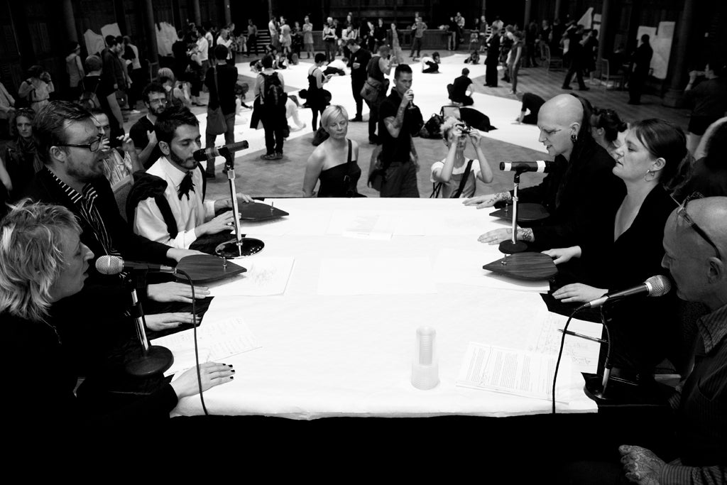 The seance table: Ron Athey (bottom right) and other readers at an automatic writing workshop.