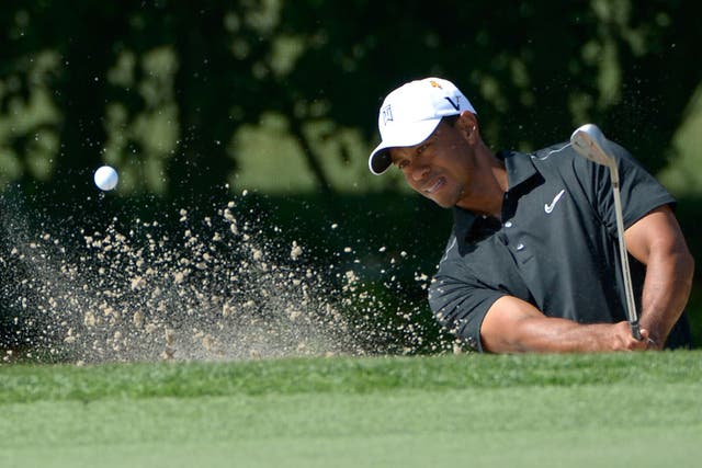 Tiger Woods chips out of a bunker during his return to form at the Bay Hill Invitational