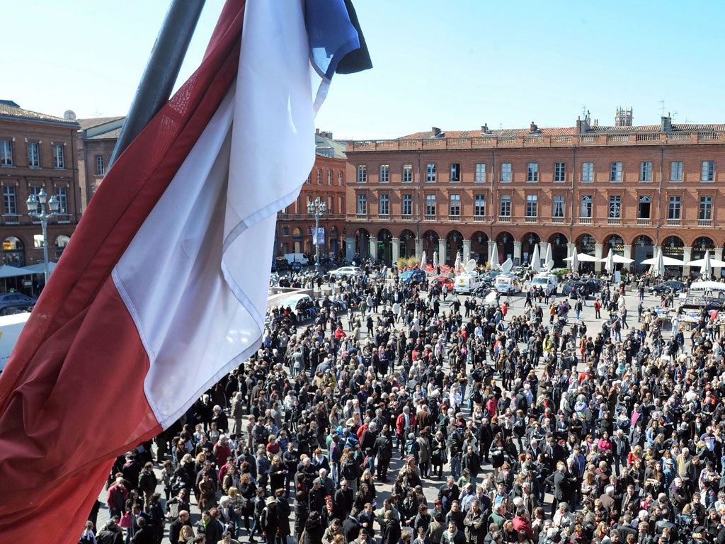 People gather in Capitol Square, Toulouse, yesterday for a vigil in memory of the victims