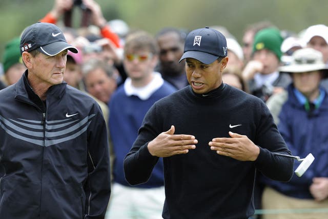 I'm all ears: Hank Haney, then Tiger Woods' coach, listens intently to his charge during the 2009 US Masters at Augusta. He has since written about Woods' private life