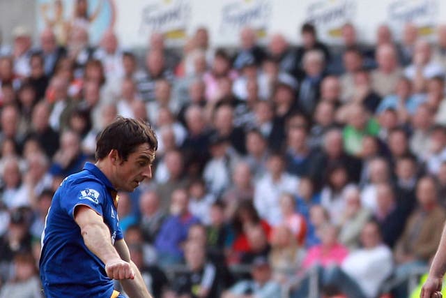 First strike: Leighton Baines scores Everton's opening goal from a free-kick