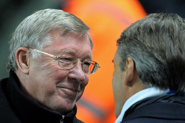 Behind the smile: Sir Alex Ferguson's mouth can act as a 12th man for United, but City's Roberto Mancini knows the score