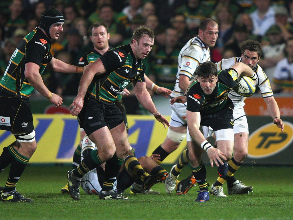Clean pair of heels: Ben Foden breaks on his way to two tries for Northampton