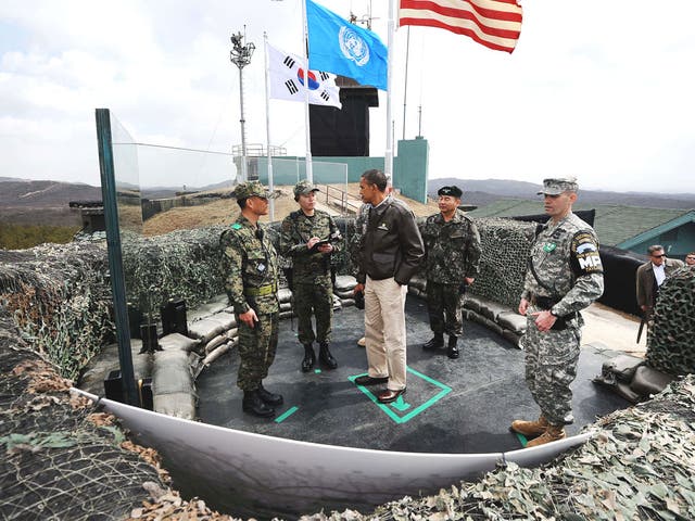 Obama listens to South Korean officers during a visit to the
Demilitarised Zone