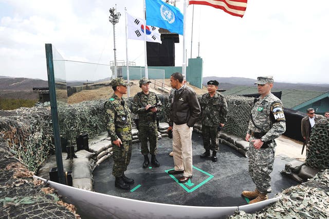 Obama listens to South Korean officers during a visit to the
Demilitarised Zone
