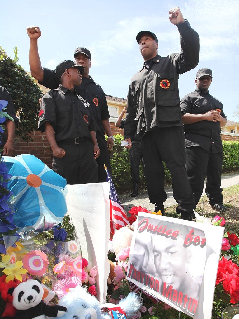 Members of the New Black Panthers cheered as their leader
urged ‘an eye for an eye’ for the shooting