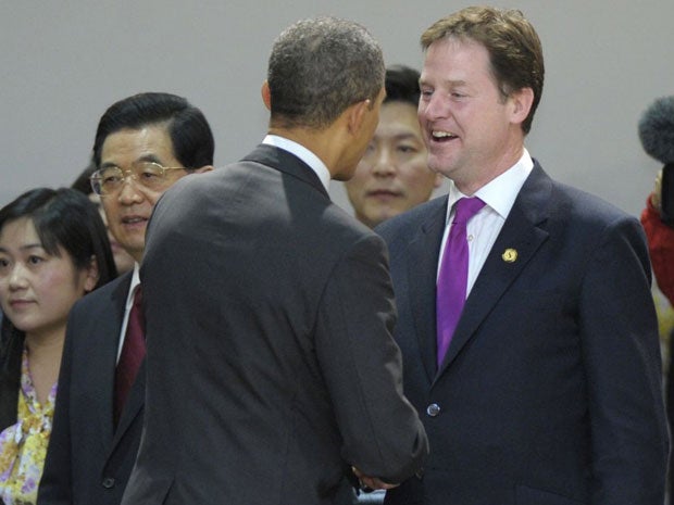 Barack Obama, centre, talks with Nick Clegg at the Nuclear Security Summit