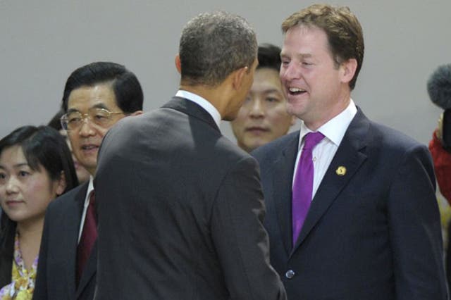Barack Obama, centre, talks with Nick Clegg at the Nuclear Security Summit