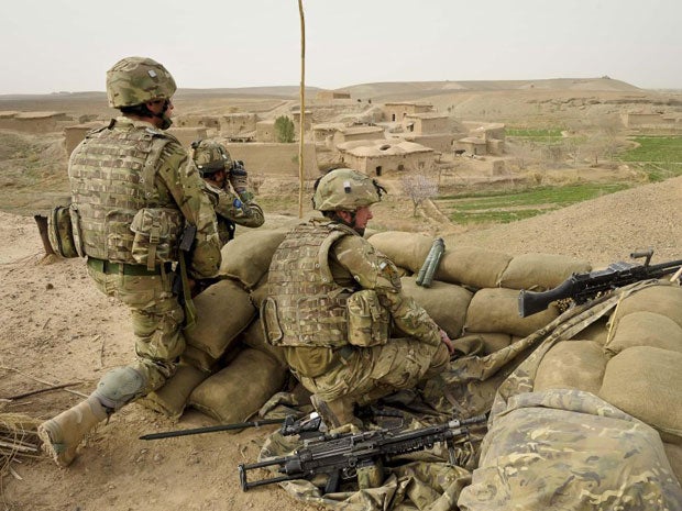 A gunman in an Afghan army uniform shot dead two British troops inside a base in southern Afghanistan today