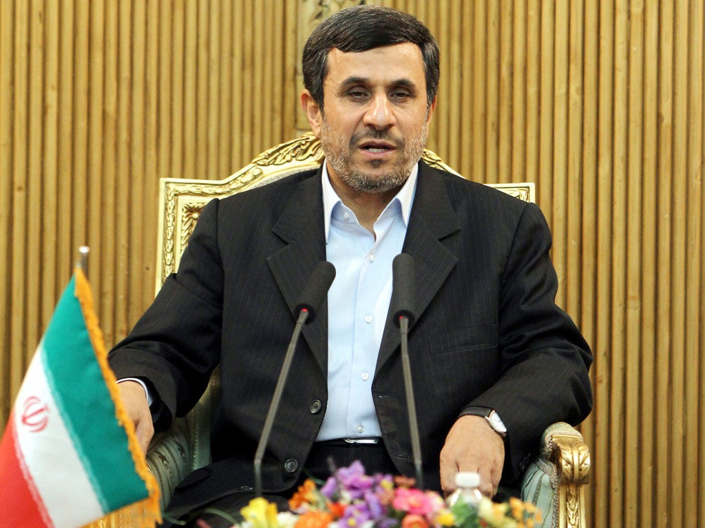 President Mahmoud Ahmadinejad speaks in Tehran before leaving for Tajikistan