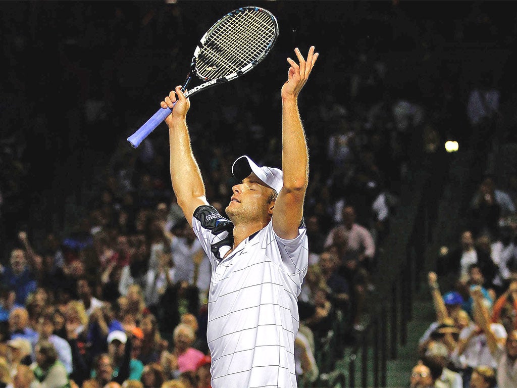 Andy Roddick enjoys his victory over Roger Federer in Miami