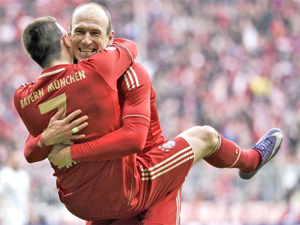 Arjen Robben holds Franck Ribéry as the two wingers celebrate one of many goals during Bayern's recent hot streak