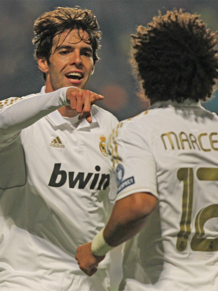 Kaka celebrates his goal with fellow Brazilian Marcelo