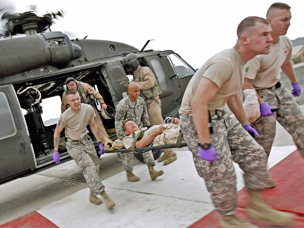 A wounded British serviceman is airlifted out of Afghanistan