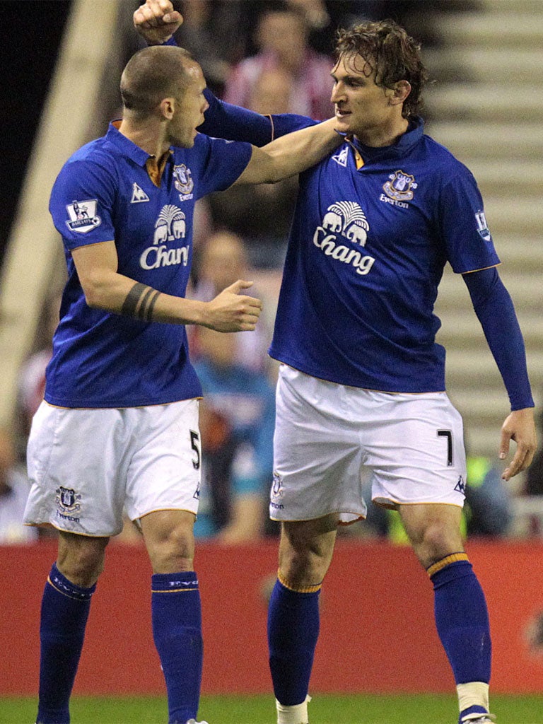 Everton goalscorer Nikica Jelavic (right) is congratulated by John Heitinga