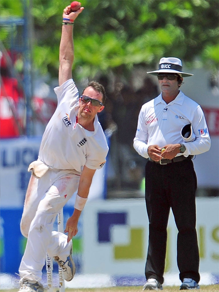 Graeme Swann delivers a ball during the third day