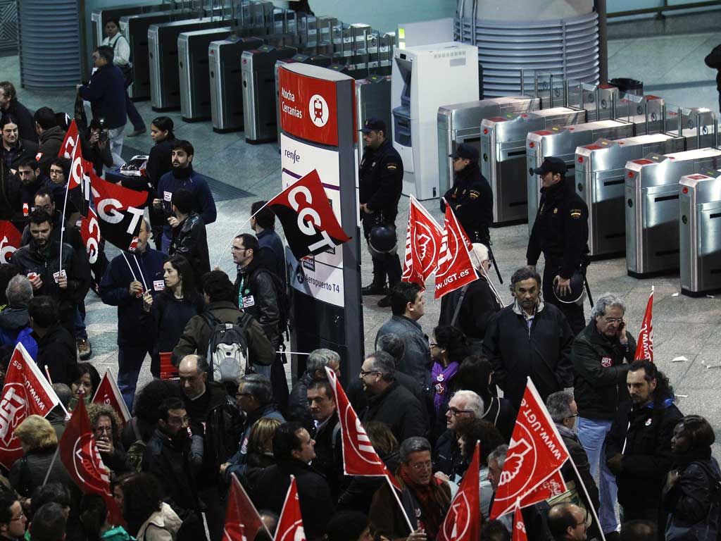 Protesters target Madrid's Atocha railway station during the general strike