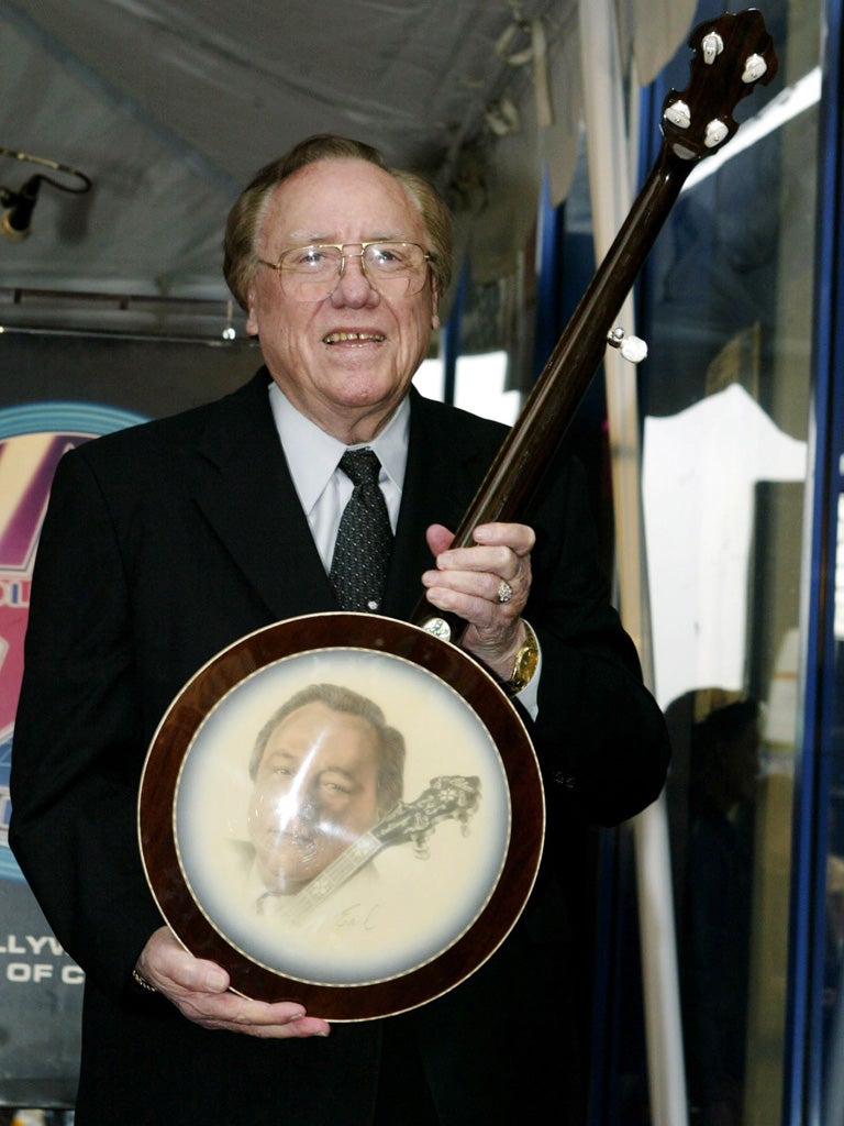 Scruggs poses as his star is unveiled on the Hollywood Walk of Fame