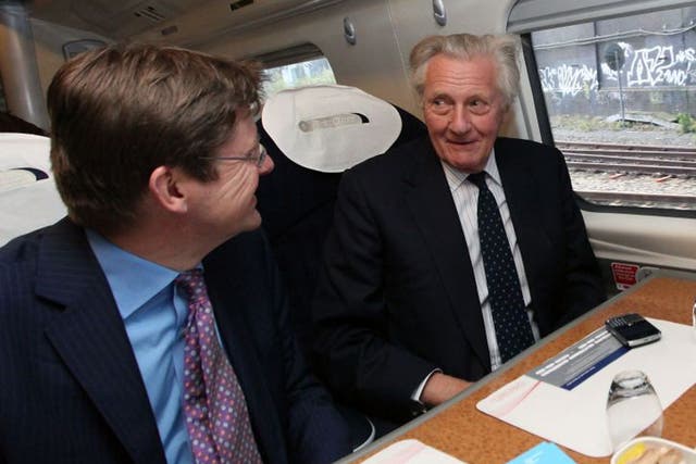 The Minister for Cities, Greg Clark, with Lord Heseltine on the train to Birmingham. Lord Heseltine likened the question of the Mayor of Birmingham's powers to that of Alex Salmond in Scotland