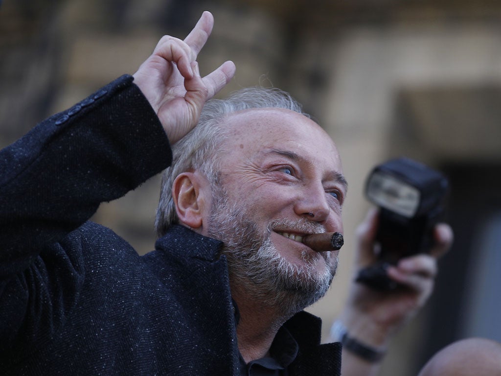 March 30, 2012:Respect Party candidate George Galloway gestures from an open top bus outside his campaign office in Bradford, northern England. Galloway, an anti-war campaigner in the small, left-wing Respect party, beat Labour's Imran Hussain in a result