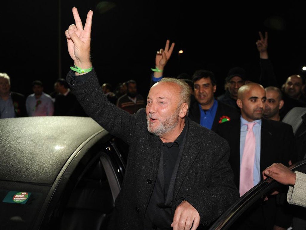 George Galloway of the Respect Party celebrates with his supporters after winning the Bradford West by-election at the Richard Dunn Sports Centre