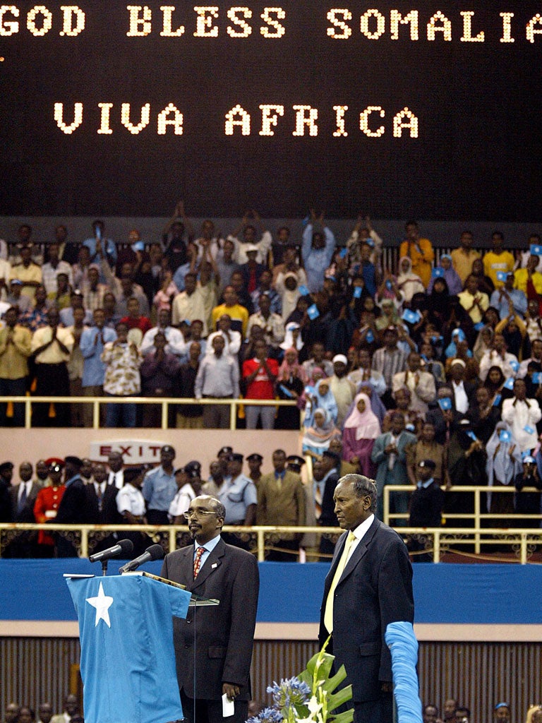 Yusuf, right, is sworn in as president of Somalia in 2004