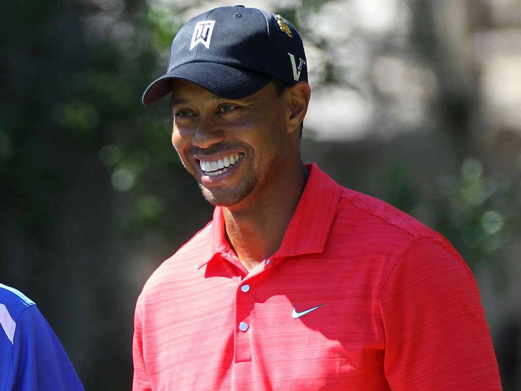Winning smile: Woods reclaims his old position as Augusta favourite